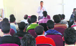 An expert speaks at a workshop on beekeeping at HESCO, near Dehradun, on Friday.