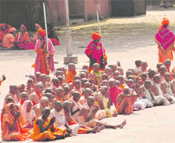 Sanyasins of the Juna Akhada perform rituals at the Alaknanda Ghat.