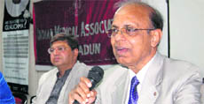 Dr MC Luthra, eye specialist, speaks at a camp in Dehradun on Friday.
