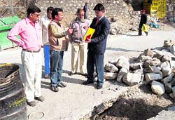 Advocate Ajay Veer Pundir listens to the encroachment complaints on the direction of the High Court in Mussoorie.