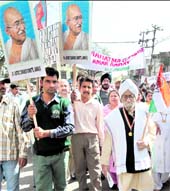 Members of the District Congress Committee participate in a rally to commemorate the historic Dandi March of Mahatma Gandhi, in Jammu on Friday
