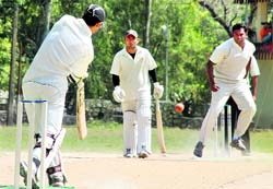 A batsman plays a defensive shot in a match of the Jitendra Anand Memorial Cricket Tournament in Dehradun on Saturday.
