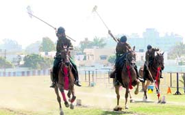 Cadets of the Rashtriya Indian Military College participate in the tent-pegging competition held in Dehradun on Saturday.