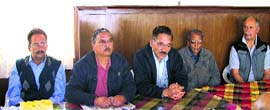 Members of the Nainital and Mussoorie Hotel Association address mediapersons in Mussoorie on Saturday.