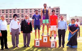 Medal winners with ADGP Rajinder Singh during the annual athletics meet of Desh Bhagat Group of Institutes at Mandi Gobindgarh. A Tribune photograph