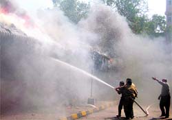 Firefighters douse a fire that broke out at MC office parking in Ludhiana
