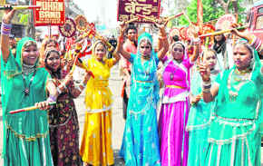 Girls present a garbha dance; a panoramic view of the procession; and saints of the akhada. 