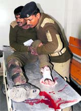 An injured CRPF jawan being helped by a colleague at a hospital in Srinagar on Sunday.