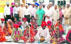 Couples tie knot at a mass marriage programme in Raikot. A Tribune photograph