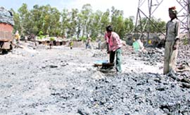 Fly ash being openly dumped at Focal Point in Ludhiana. Tribune photo: Himanshu Mahajan