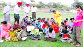 Students of Baba Banda Singh Bahadur Engineering College teach children of nearby slum areas on the campus in Fatehgarh Sahib. Photo by writer