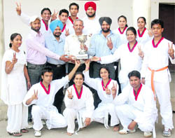 Winners of the Inter-College Tae-Kwon-Do Championship with their trophy in Patiala