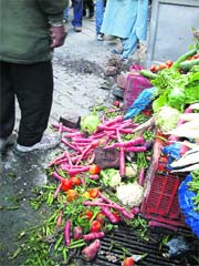Vegetables lying on the road after an anti-encroachment drive being conducted in Mussoorie on Monday.