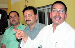 Congress MLA Kishore Upadhaya, addresses a press conference in Dehradun on Sunday.