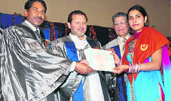 MP Arvind Sharma presents a degree to a student at the IGNOU convocation in Karnal