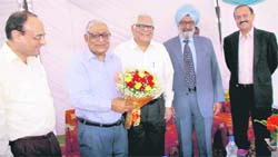 (From left) The Tribune General Manager Sanjay Hazari, outgoing Editor-in-Chief HK Dua, Trustees Prof RP Bambah and Justice SS Sodhi and new Editor-in-Chief Raj Chengappa at the farewell function on Monday.