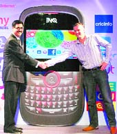 Aircel COO Gurdeep Singh (L) and Frank Meehan chief executive, INQ Mobile, shake hands during a press conference to announce their partnership and launch of social mobile in New Delhi on Tuesday.