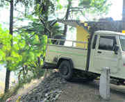 Construction debris is dumped at a slope along the McLeodganj-Bhagsunag road.