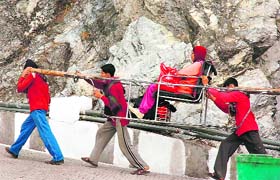 A devotee being carried to the Vaishno Devi shrine on the beginning of the Navratra festival on Tuesday.