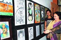 Visitors take a look at the painting and sketches at LPU.