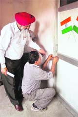 MC officials seal office of a company for failing to deposit house tax in Ludhiana on Tuesday.