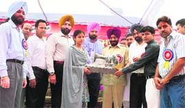 Sewing machines being distributed to a family of terror victim by All-India Anti-Terrorist Front chief Maninderjit Singh Bitta at Mandi Gobindgarh on Tuesday.