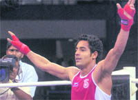 Indias Amandeep reacts after winning his match against Malyasias M Redzuan during the semifinals in New Delhi