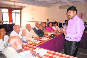 Dr Aju Phillp interacts with elderly persons at a function in Dehradun