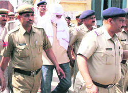 STF chief Ashok Sheoran being produced at a court in Panipat