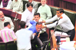 Abdul Haq of the PDP being marshalled out of the Assembly in Jammu