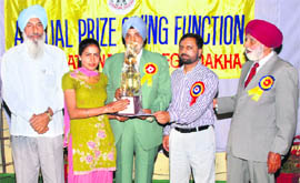 ADC, Ludhiana, Davinder Singh honours a meritorious student at Guru Tegh Bahadur National College, Dakha.