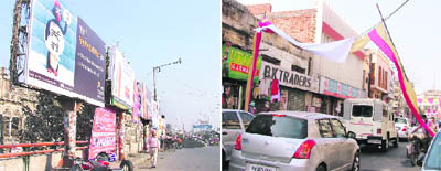Hoardings erected on the footpaths at the Jagraon bridge; and (right) welcome gates on the main road causing inconvenience to public.