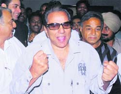 FIT & FINE: Dharmendra walks out of the PGI on Wednesday.
