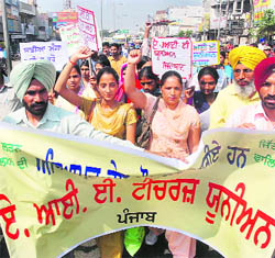Members of the AIE Teachers Union hold a protest in support of their demands in Bathinda on Wednesday. They accused the state government of ignoring their demand relating to the giving of ETT training.