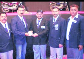 Uttarakhand Bodybuilding Association general secretary KK Paliwal receives a certificate from former Mr Universe Prem Chand Dogra for being selected a national judge