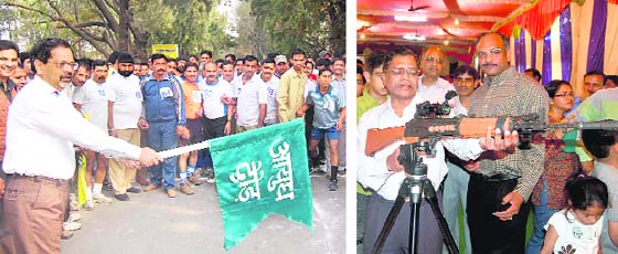Arun Khanvalkar, GM, Ordnance Factory, Dehradun, flags off a run for employees; and (right) HS Chaturvedi, GM, OLF, has a look at a laser gun at an exhibition on Ordnance Day in Dehradun