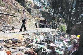  Heaps of garbage lie uncleaned near the bus stand in Shimla. 