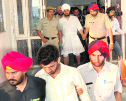 Terror suspects come out of the court premises in Dera Bassi on Friday.