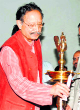 Former Chief Minister BC Khanduri lights a lamp to inaugurate a conference in Dehradun on Friday.