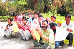 Volunteers of mission True Biologist hold a demonstration against plastic bags at the Gandhi Park in Dehradun on Friday.