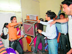ABVP activists ransack office of HPU regional centre at Dharamsala on Friday.