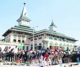Devotees pray at the shrine of Hazrat Gousul Azam Dastageer Sahab at Khanyar in Srinagar on Friday during the 11-day-long Urs of the Sufi saint . 