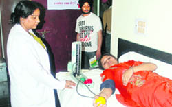 A student donates blood at a camp in Ludhiana