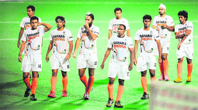 Indian hockey captain Rajpal Singh (fourth from left) leaves with teammates after the World Cup 2010 classification match that got them the eighth place at the Major Dhyan Chand Stadium in New Delhi recently 