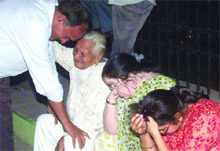 Relatives of the family grieve over the tragedy on Friday night. 