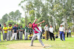 A player throws a discus at the annual sports meet of the Forest Research Institute in Dehradun 