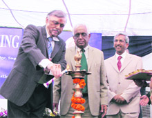 Mr Justice P Sathashivam of the Supreme Court lights the ceremonial lamp to mark the inauguration of Haryanas first evening court in Gurgaon on Saturday. 