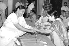 A BJP worker greets Sushma Swaraj in Ambala