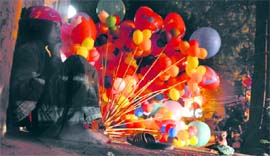 Though she adds colour to the lives of others by selling balloons, her future seems to be in the dark. Tribune photo: Himanshu Mahajan