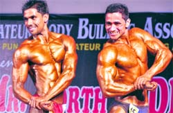 Participants flex muscles in the Mr Ludhiana and Mr North India Bodybuilding Championship held in Ludhiana on Sunday. Photo: Himanshu Mahajan